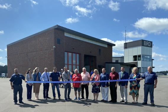 Group at ribbon cutting of new facility on Brainerd airport